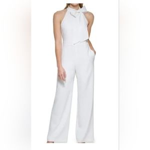 White, tie neck, wide leg jumpsuit with lining. No pockets. New with tags